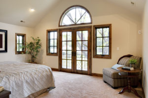 French doors leading from master bedroom to outdoor patio